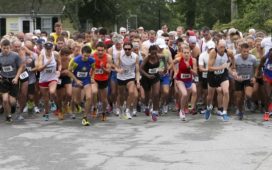 Runners take off from the starting line for the Little Compton Road Race at the United Congregational Church Fair in Little Compton, Saturday. Photo by Bill Murphy.