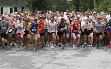 Runners take off from the starting line for the Little Compton Road Race at the United Congregational Church Fair in Little Compton, Saturday. Photo by Bill Murphy.